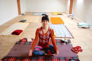a woman sitting on a rug on the floor at YXIE - Manoir des Arts in Villeblevin +25 photos