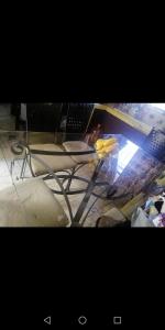 a table with a laptop computer on top of it at Habitación en Casa Compartida in Monterrey