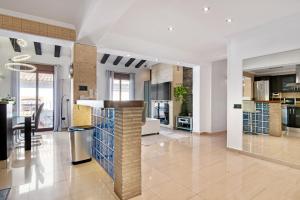 a large kitchen with a island in the middle at Somni in Jávea