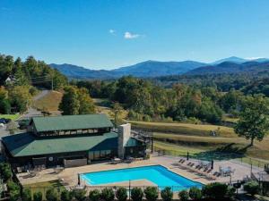 an aerial view of a building with a swimming pool at Mountain Bliss in Townsend