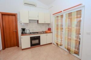 Η κουζίνα ή μικρή κουζίνα στο Apartments Filipovic
