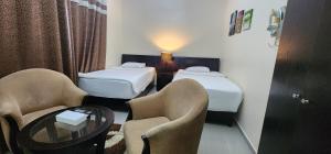 Postel nebo postele na pokoji v ubytování Al Smou Hotel Apartments - MAHA HOSPITALITY GROUP