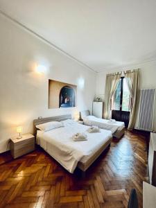 Postel nebo postele na pokoji v ubytování Centro Storico Suites