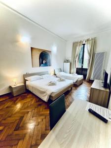 Postel nebo postele na pokoji v ubytování Centro Storico Suites