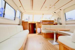 a view of the inside of a boat with a table at YACHT DEAUVILLE in Deauville