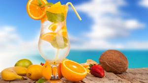 a drink with fruit and nuts on a table at Ô Bleu Azur in Antsatrakolo