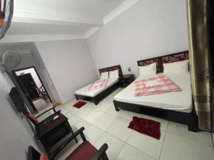 En eller flere senge i et værelse på HOÀNG VY HOTEL Quan Lạn