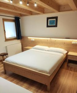 Postel nebo postele na pokoji v ubytování Chalet - Margherita