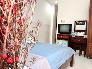 Giường trong phòng chung tại Saigon Cozy2 Hotel