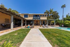 an exterior view of a house with a yard at SB-316 - Sunset Hacienda in Solana Beach