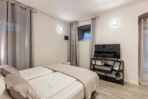 Posteľ alebo postele v izbe v ubytovaní Apartments and Rooms Villa Lina