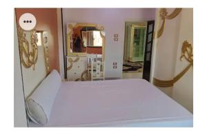 Postel nebo postele na pokoji v ubytování Amira Hospitality House