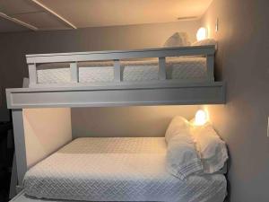 two bunk beds in a small room with lights at Private Suite in Davison in Davison