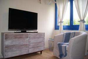 Μια τηλεόραση ή/και κέντρο ψυχαγωγίας στο Apartamento con encanto L'Estany 1