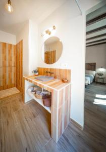 a bathroom with a sink and a mirror at Eco Hotel Cueva del Gato in Benaoján