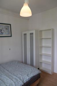 En eller flere senge i et værelse på Noclegi - Wyspa Słodowa