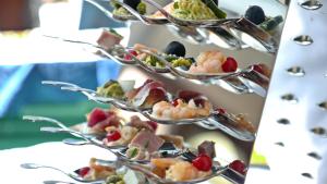 a row of dishes of food on a table at Agriturismo Villa Bardi struttura con camere vista mare in Riva Trigoso +13 photos