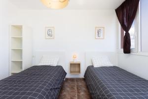 Postel nebo postele na pokoji v ubytování Caletillas Vista Mar Home