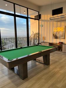 a billiard room with a green pool table at Departamento frente al TSM in Torreón