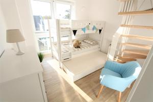 Postel nebo postele na pokoji v ubytování Nordsee Park Strandhuus,11b