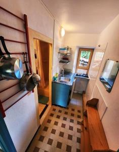 a small kitchen with a sink and a counter at Cosy au pied du pic bugarach in Bugarach +1 photo