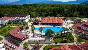 an aerial view of a resort with a swimming pool at Lykia Botanika Beach Fun & Club - All Inclusive in Fethiye
