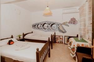 A bed or beds in a room at Berat Backpackers Hostel