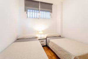 Postel nebo postele na pokoji v ubytování Precioso apartamento