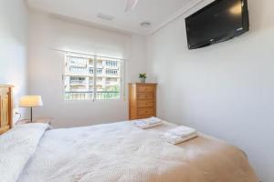 Postel nebo postele na pokoji v ubytování Precioso apartamento