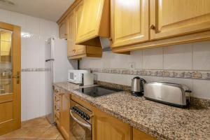 Kuchyň nebo kuchyňský kout v ubytování Precioso apartamento