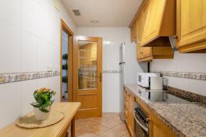 Kuchyň nebo kuchyňský kout v ubytování Precioso apartamento