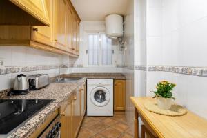 Kuchyň nebo kuchyňský kout v ubytování Precioso apartamento + 19 fotografií