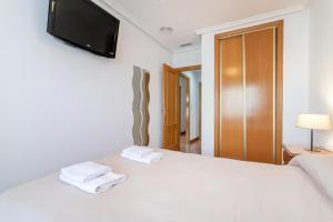 Postel nebo postele na pokoji v ubytování Precioso apartamento
