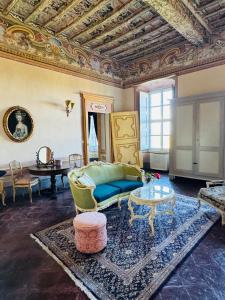 a living room with a couch and a table at Castello Canalis in Cumiana