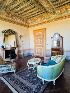 a living room with a couch and a table at Castello Canalis in Cumiana