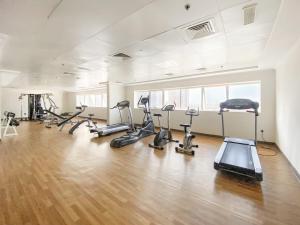 a gym with several treadmills and exercise bikes in it at Silkhaus Luxury 1 BDR with Metro Nearby in Dubai