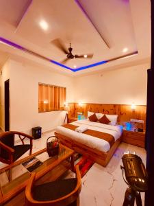 a bedroom with a bed and a ceiling at Sumitra Guest House in Amritsar