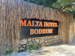 a sign for a matilla hotel booth at Malta Hotel Bodrum in Bodrum City