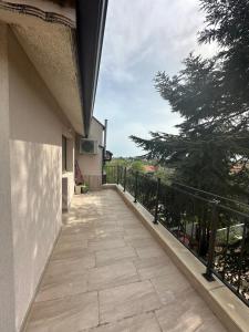 a balcony of a house with a walkway at Varna Vinitsa in Varna City