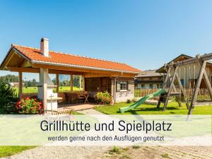 a house with a playground with a slide at Biohof Burger, 3 sonnige Fewo, alle mit Balkon, Spielzimmer, Grillhütte, 7 km vor Oberstdorf in Bolsterlang +86 photos