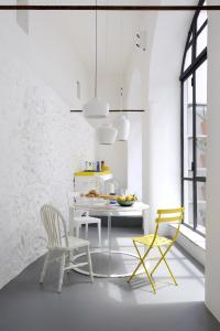 a kitchen with a white table and two chairs at Capri Kronos GuestHouse in Anacapri