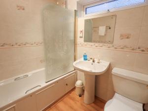 a bathroom with a sink and a toilet and a shower at Tanna Hill in Bowness-on-Windermere +47 photos