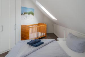 Postel nebo postele na pokoji v ubytování Haus Rieke Bordumer Str 13A, 105qm