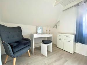 Ein Sitzbereich in der Unterkunft Haus Waldesblick An der Rennweide 26a 75 qm