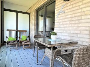 Balkón nebo terasa v ubytování Apartment Silbermöwe, Am Alten Deich 22 6