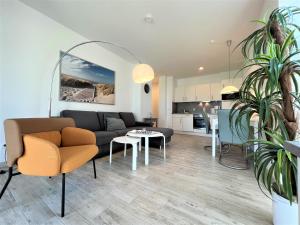Posezení v ubytování Apartment Silbermöwe, Am Alten Deich 22 6
