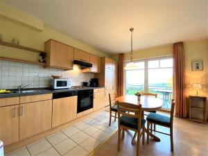 Η κουζίνα ή μικρή κουζίνα στο Haus Tante Clara Whg 18, Kukshörner Weg 8B 65qm