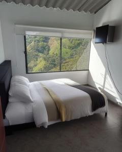 Postel nebo postele na pokoji v ubytování Ecohotel Portillo