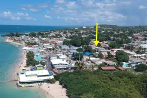 an aerial view of a town next to the beach at Sandy Shores Retreat Beach Apt in Cabo Rojo in Boqueron +1 photo