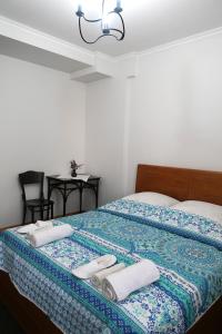Postel nebo postele na pokoji v ubytování guest house Merci